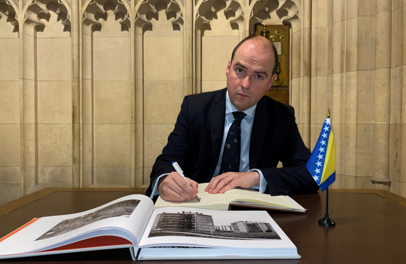 Richard signs Balkans War memorial book