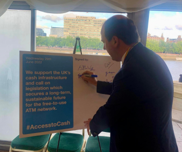 Richard signs Access to Cash pledge