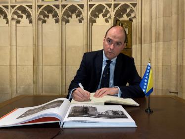 Richard signs Balkans War memorial book